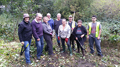 Newsome volunteers working together outdoors